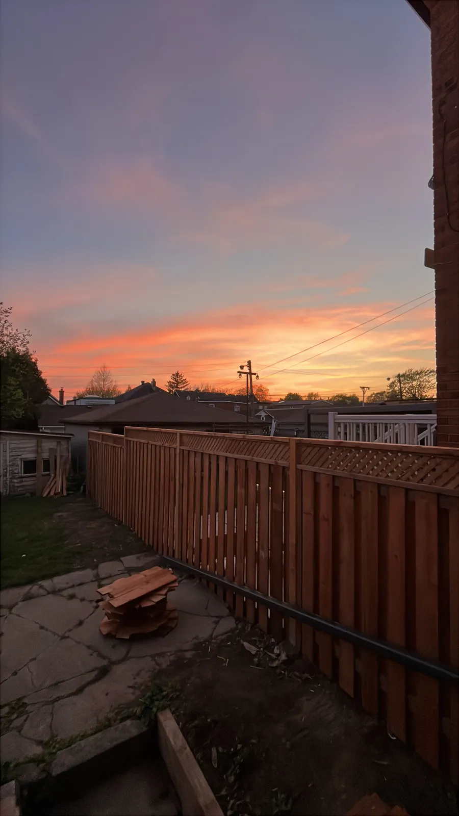 Cedar fence with lattice top at sunset